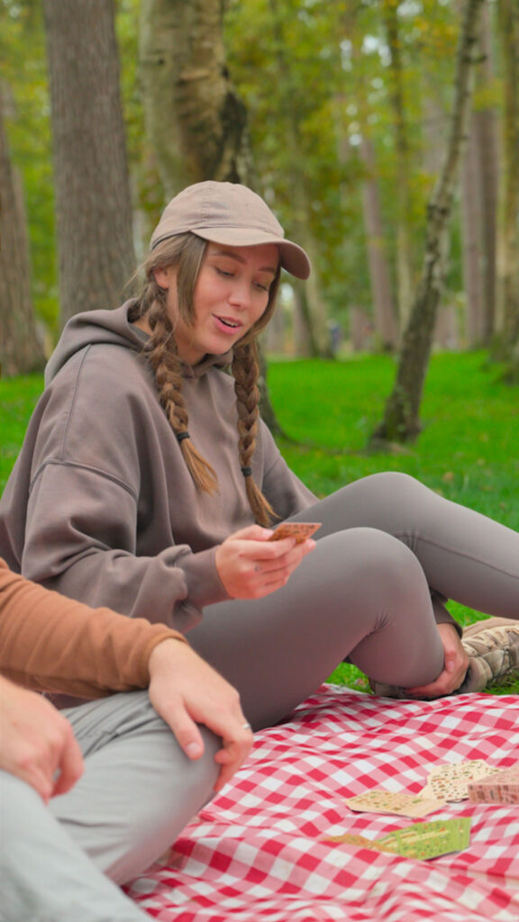 Lucy playing Camping Conversations card game